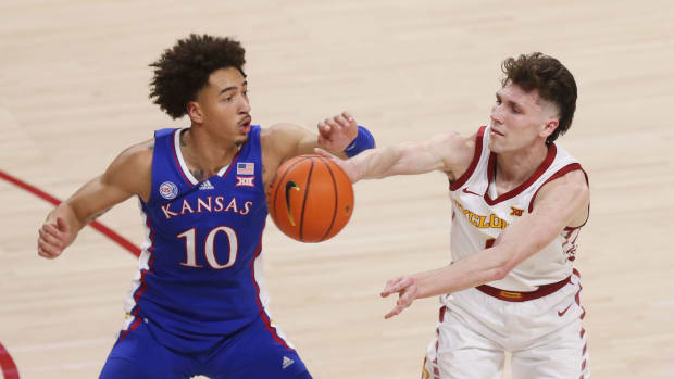 Iowa State University Cyclones guard Caleb Grill (2) passes the ball around Kansas Jayhawks forward Jalen Wilson (10) during the second half at Hilton Coliseum Saturday, Feb. 4, 2023, in Ames, Iowa. Kansas And Iowa State Men S Basketball